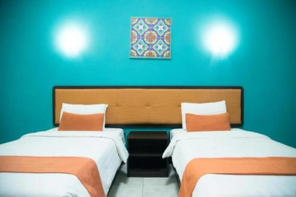 Bed in Ole Suite Hotel