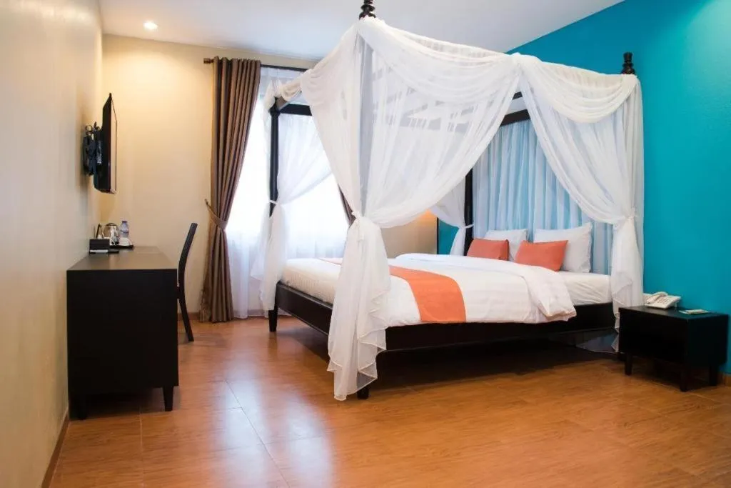 Bed in Ole Suite Hotel