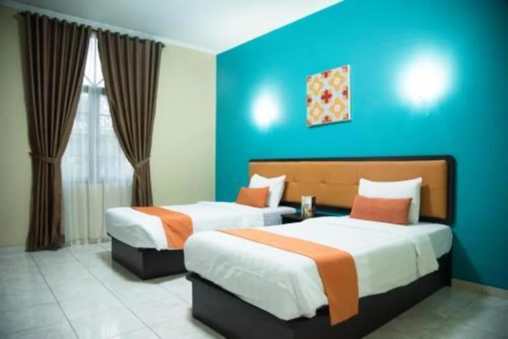 Bed in Ole Suite Hotel