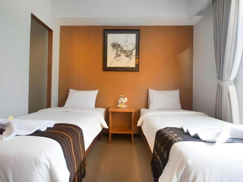 Bed in Hadi Poetra Hotel