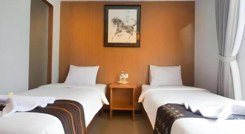 Bed in Hadi Poetra Hotel