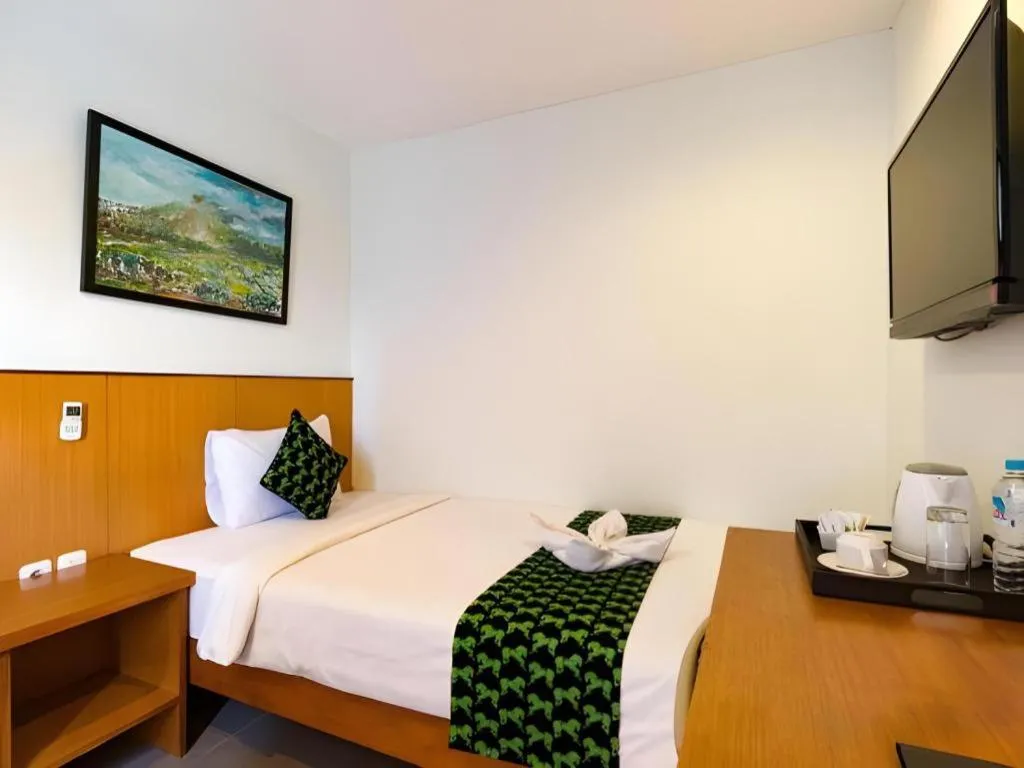 Bed in Hadi Poetra Hotel