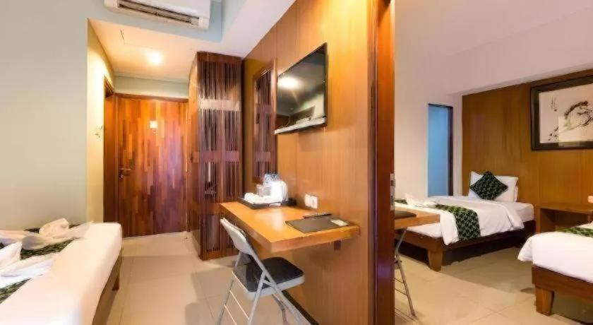 Bed in Hadi Poetra Hotel