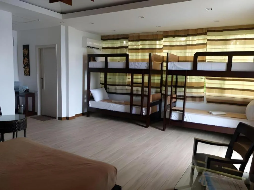 Bed in Anilao Awari Bay Resort