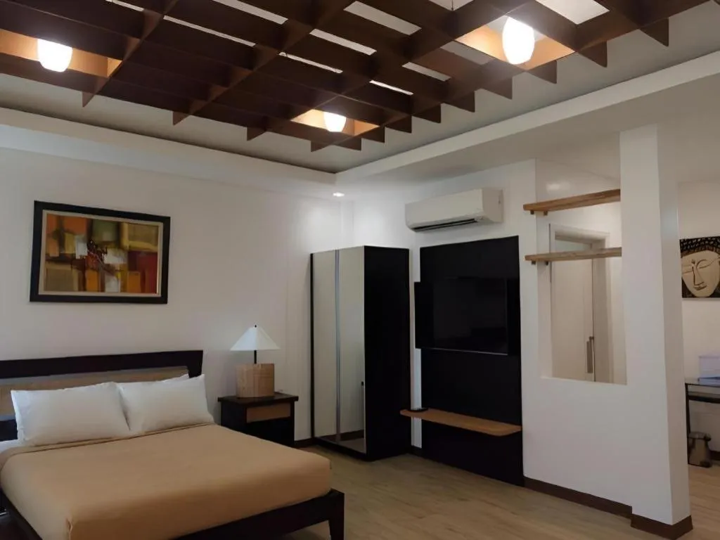 Bed in Anilao Awari Bay Resort