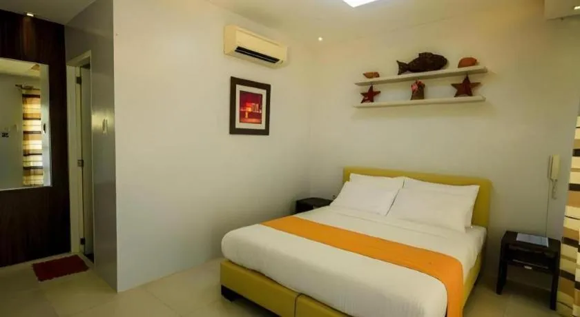 Bed in Anilao Awari Bay Resort