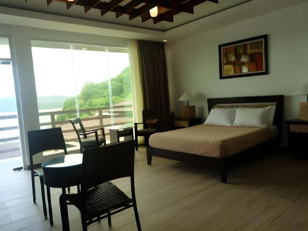 Bed in Anilao Awari Bay Resort