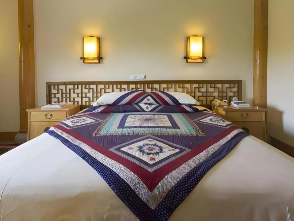Bed in The Silk Road Dunhuang Hotel