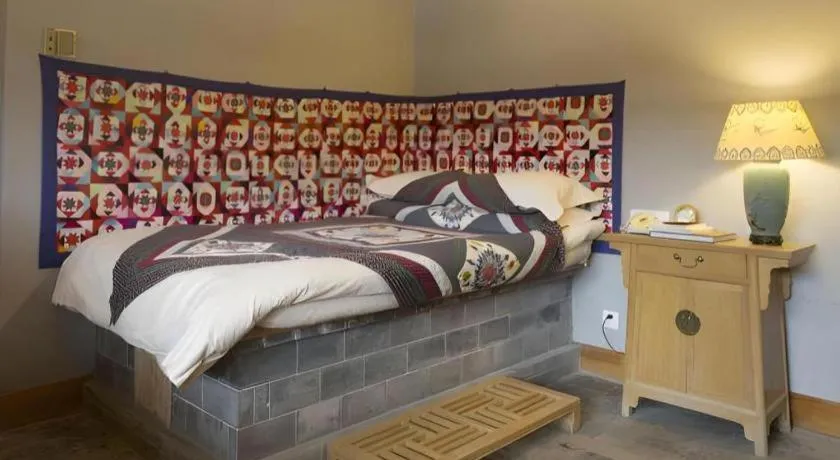 Bed in The Silk Road Dunhuang Hotel