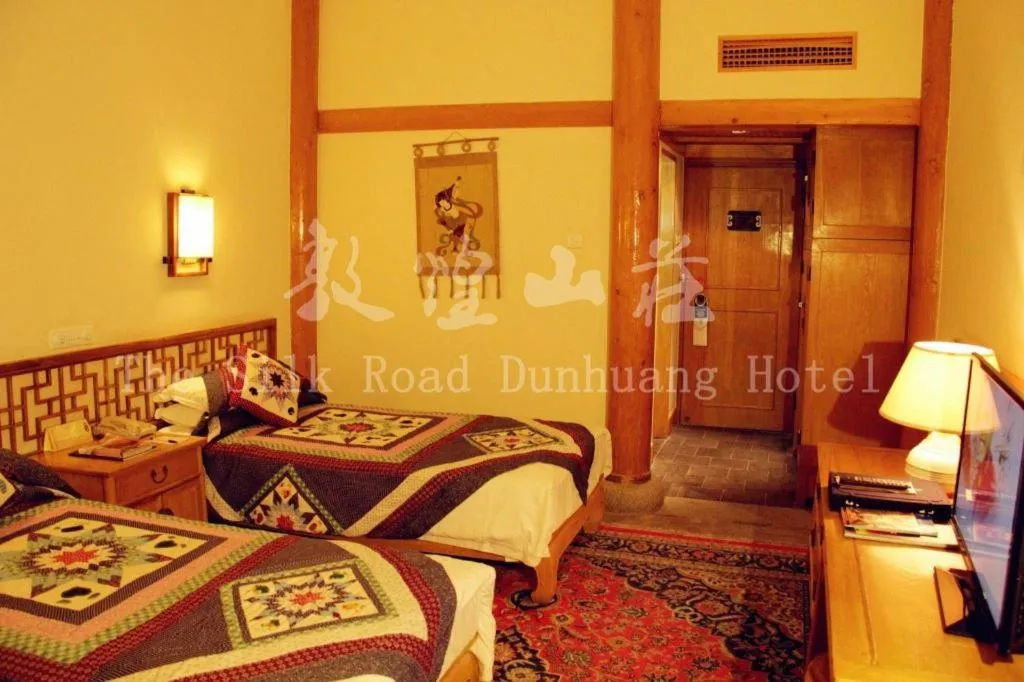 Bed in The Silk Road Dunhuang Hotel