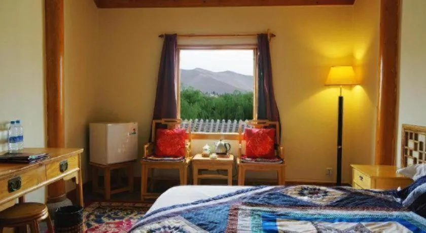 Bed in The Silk Road Dunhuang Hotel