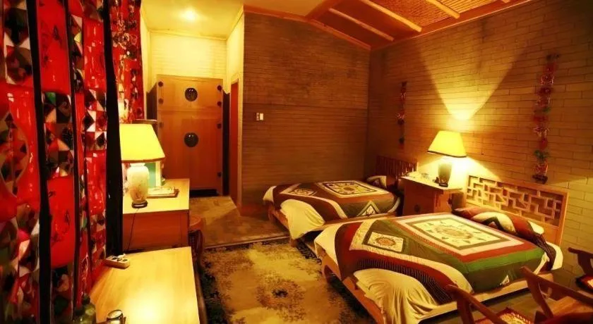 Bed in The Silk Road Dunhuang Hotel