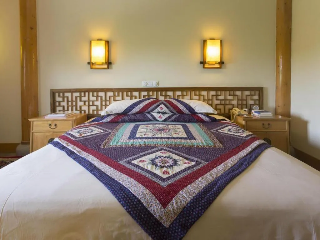 Bed in The Silk Road Dunhuang Hotel