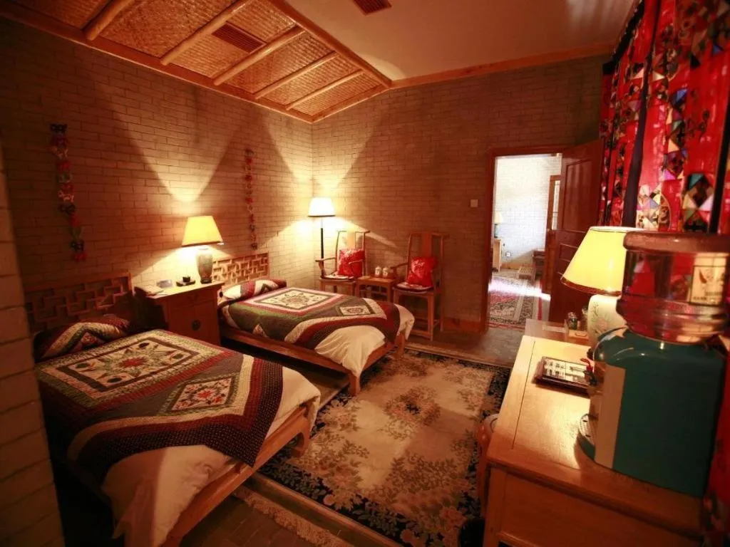 Bed in The Silk Road Dunhuang Hotel