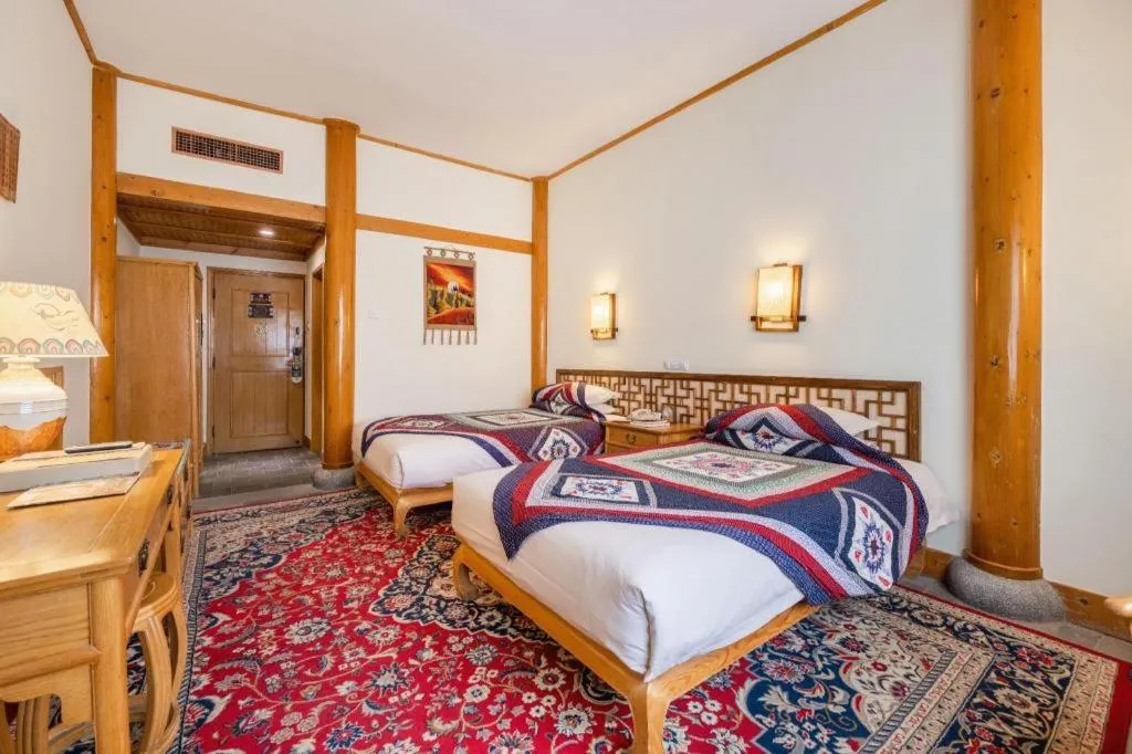 Bed in The Silk Road Dunhuang Hotel