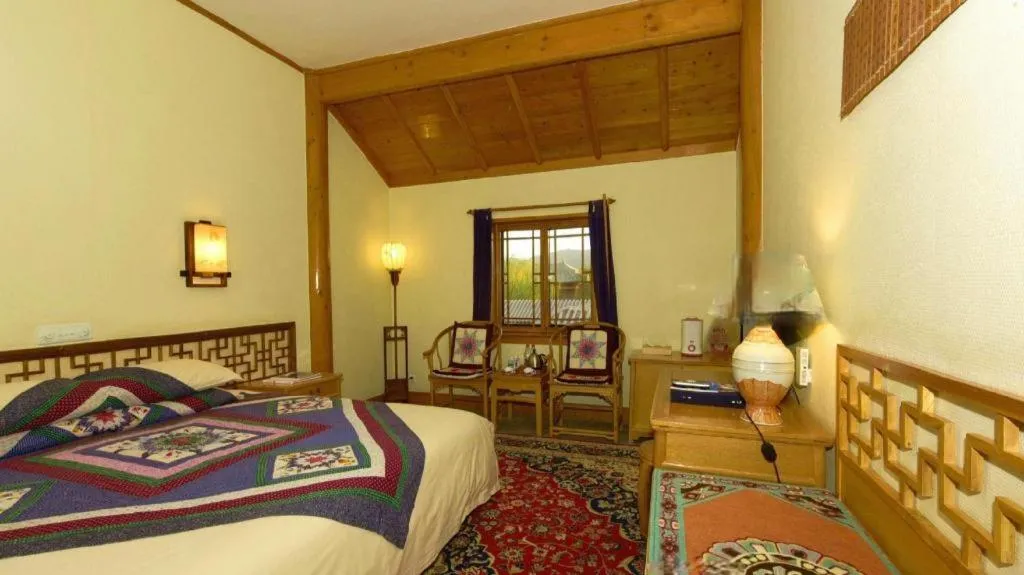 Bed in The Silk Road Dunhuang Hotel