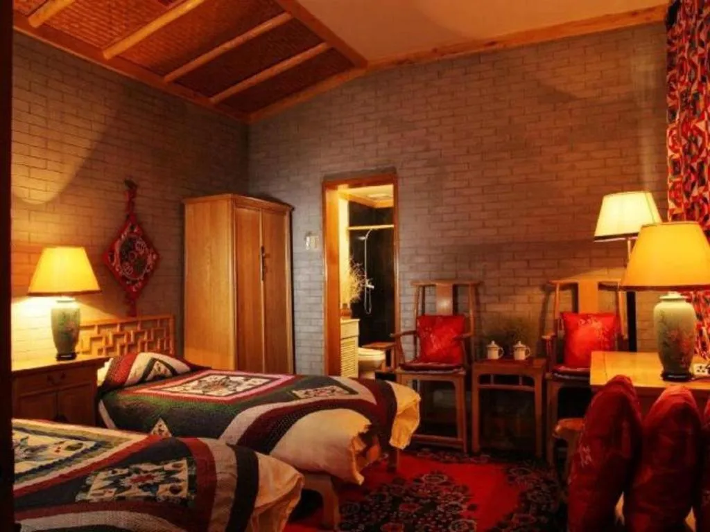 Bed in The Silk Road Dunhuang Hotel