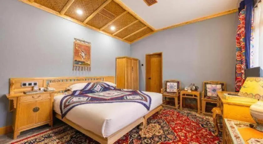 Bed in The Silk Road Dunhuang Hotel