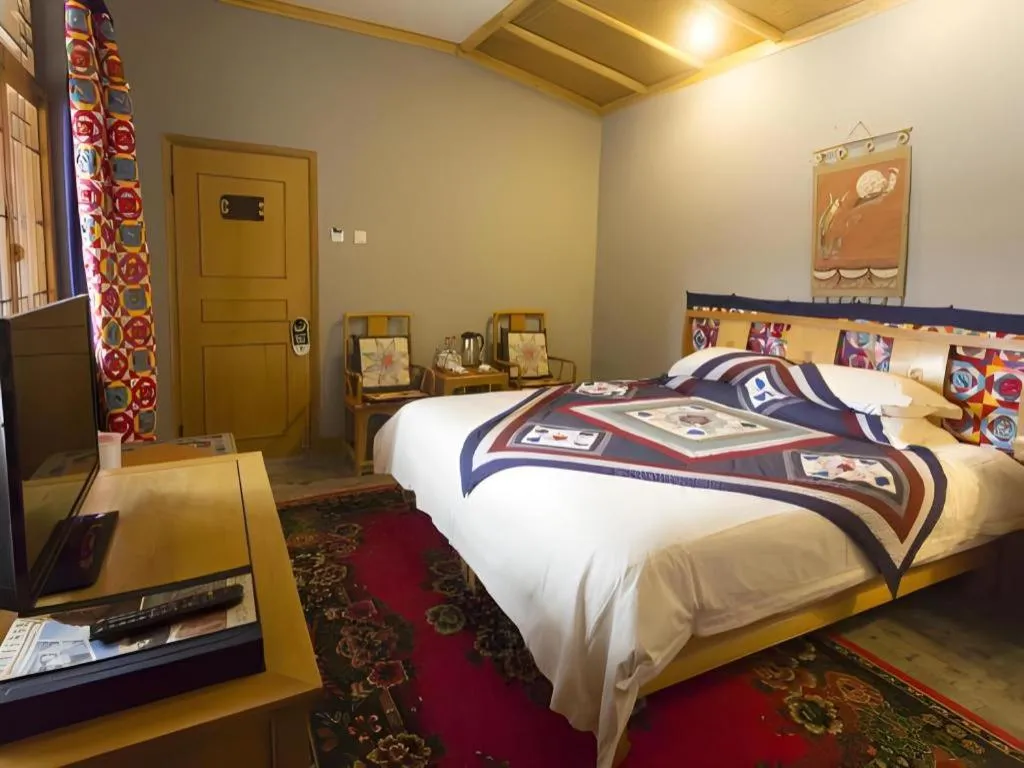 Bed in The Silk Road Dunhuang Hotel