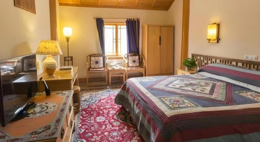 Bed in The Silk Road Dunhuang Hotel