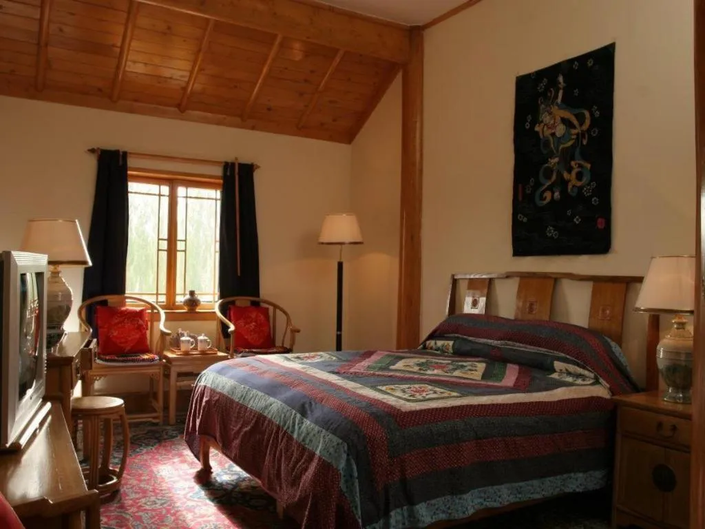 Bed in The Silk Road Dunhuang Hotel