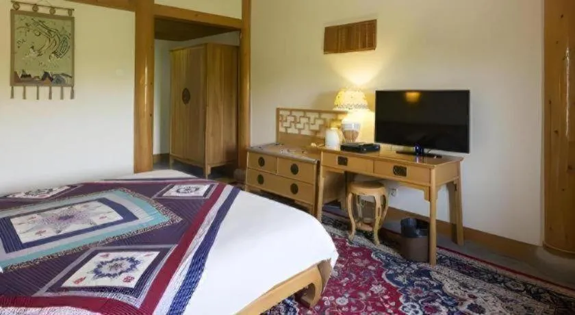 Bed in The Silk Road Dunhuang Hotel