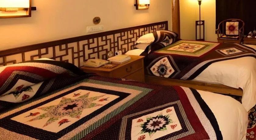 Bed in The Silk Road Dunhuang Hotel