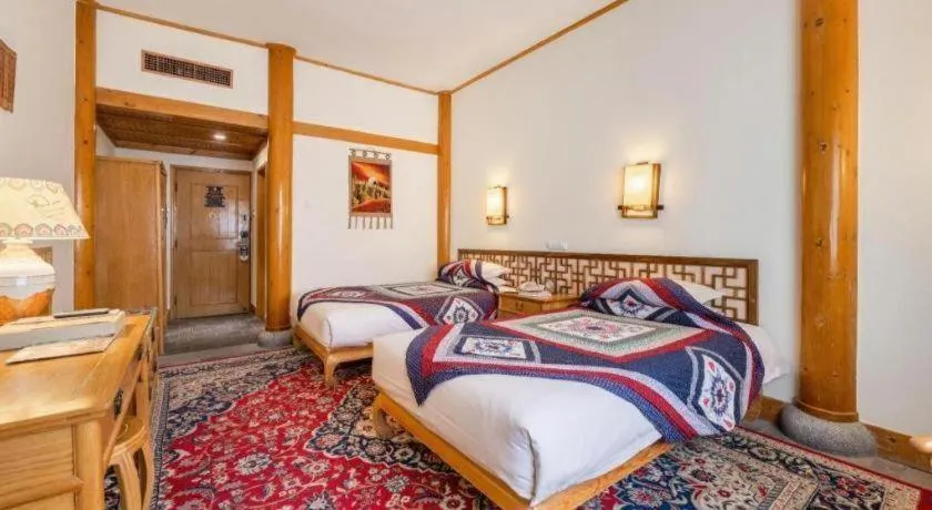 Bed in The Silk Road Dunhuang Hotel