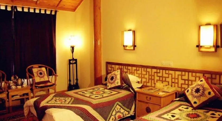 Bed in The Silk Road Dunhuang Hotel