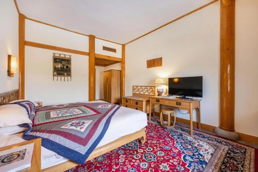 Bed in The Silk Road Dunhuang Hotel