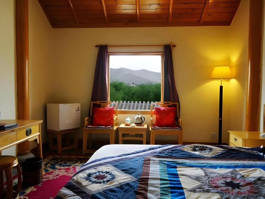 Bed in The Silk Road Dunhuang Hotel