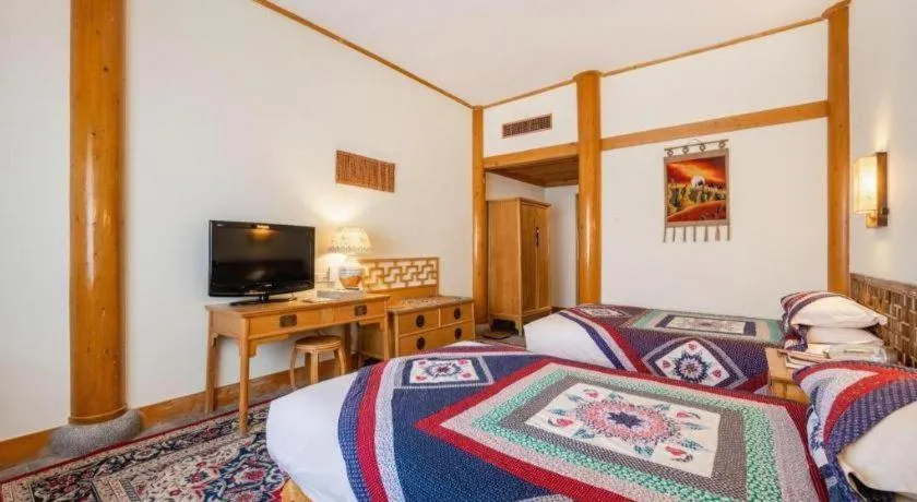 Bed in The Silk Road Dunhuang Hotel