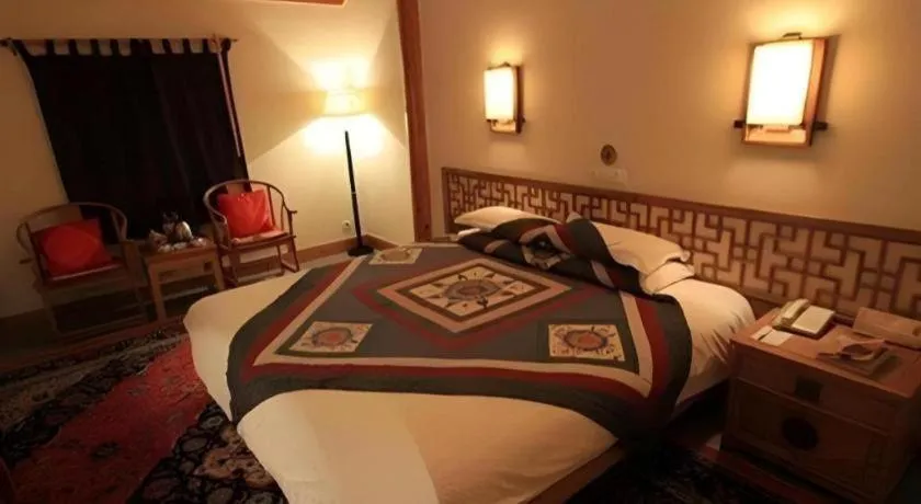 Bed in The Silk Road Dunhuang Hotel