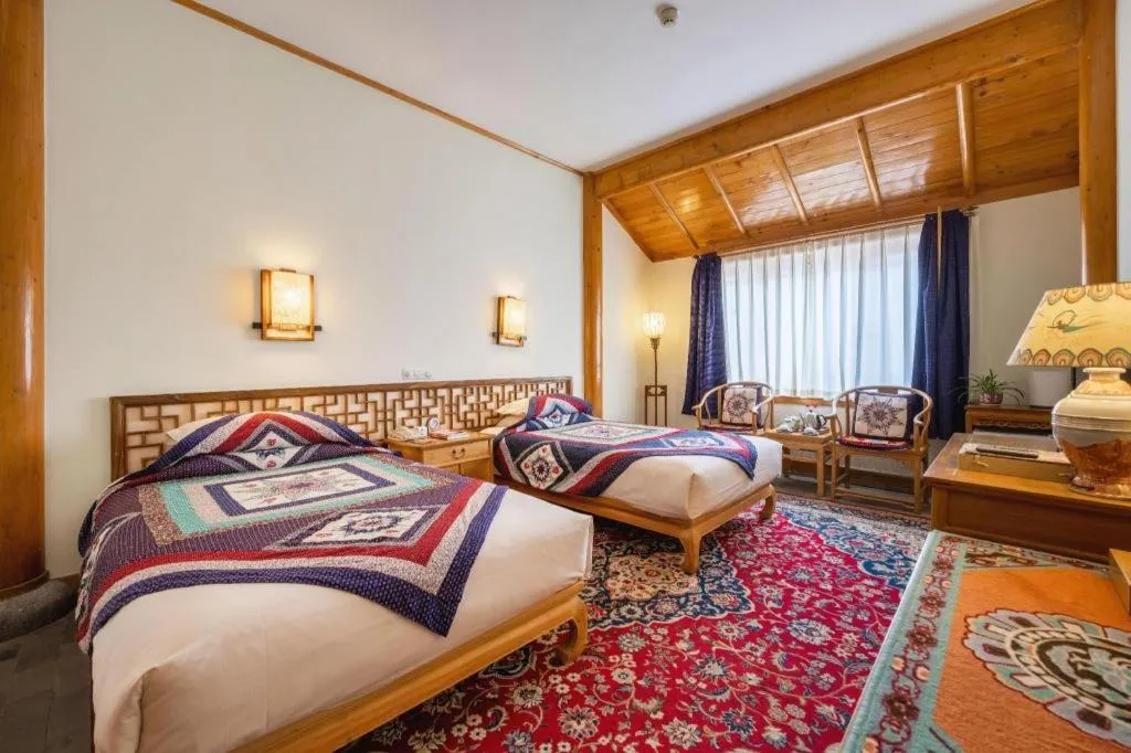 Bed in The Silk Road Dunhuang Hotel