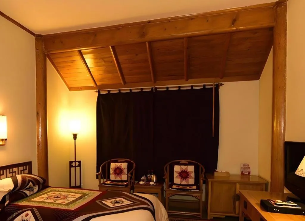 Bed in The Silk Road Dunhuang Hotel