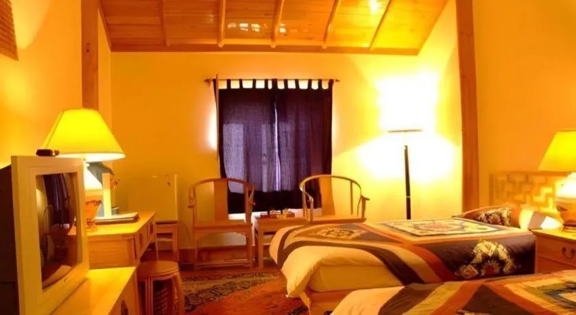 Bed in The Silk Road Dunhuang Hotel