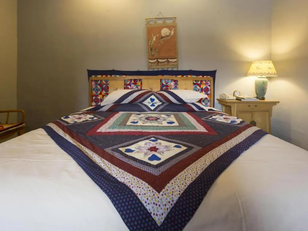Bed in The Silk Road Dunhuang Hotel
