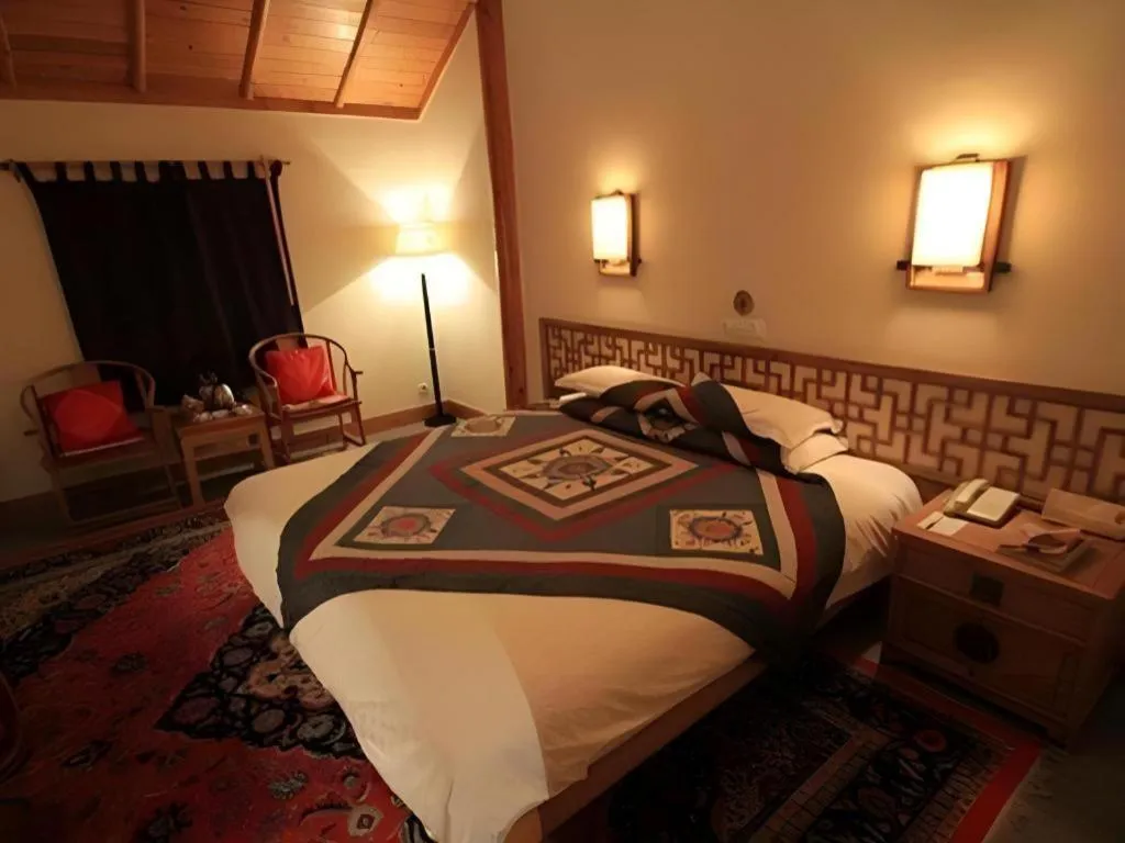 Bed in The Silk Road Dunhuang Hotel