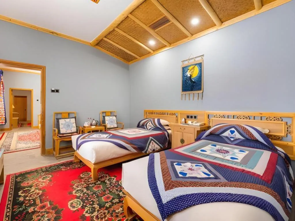 Bed in The Silk Road Dunhuang Hotel