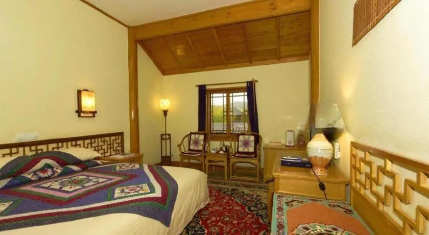 Bed in The Silk Road Dunhuang Hotel