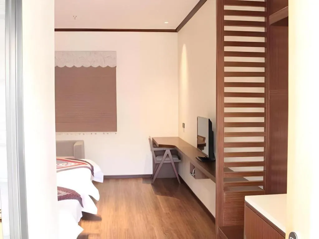 Bed in The Silk Road Dunhuang Hotel