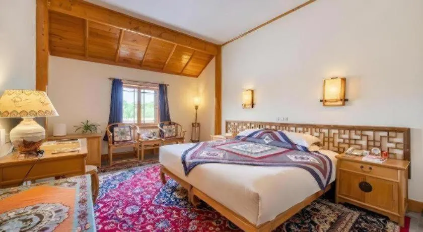 Bed in The Silk Road Dunhuang Hotel