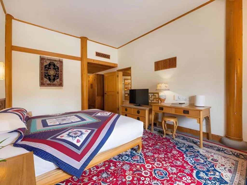 Bed in The Silk Road Dunhuang Hotel