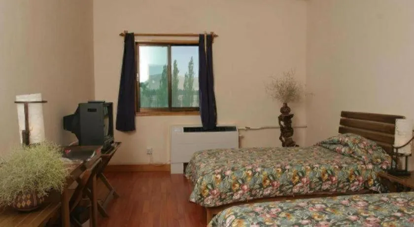 Bed in The Silk Road Dunhuang Hotel