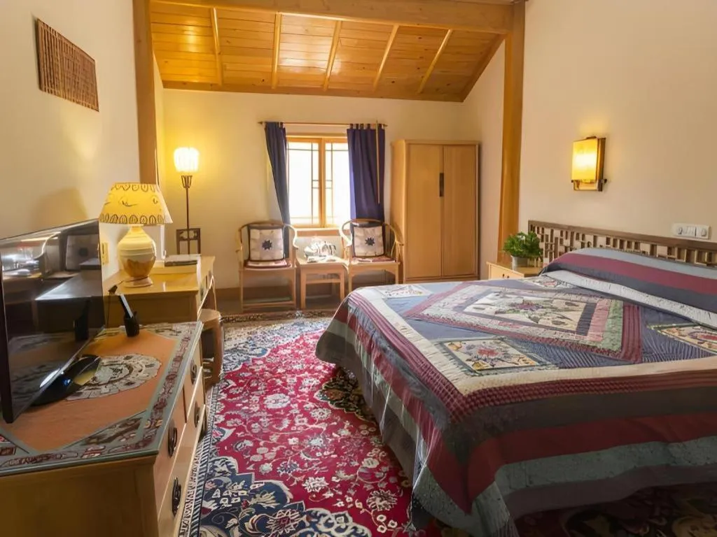 Bed in The Silk Road Dunhuang Hotel