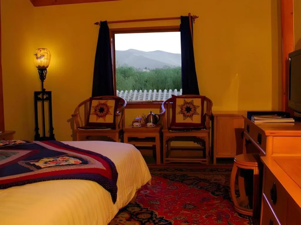 Bed in The Silk Road Dunhuang Hotel