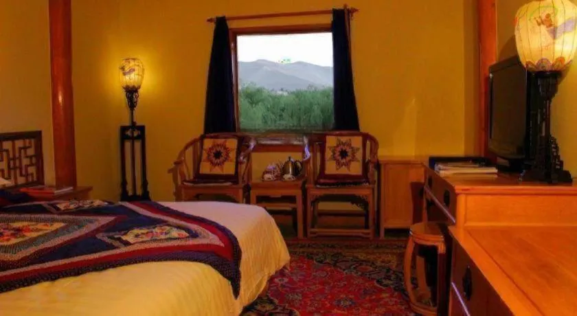 Bed in The Silk Road Dunhuang Hotel