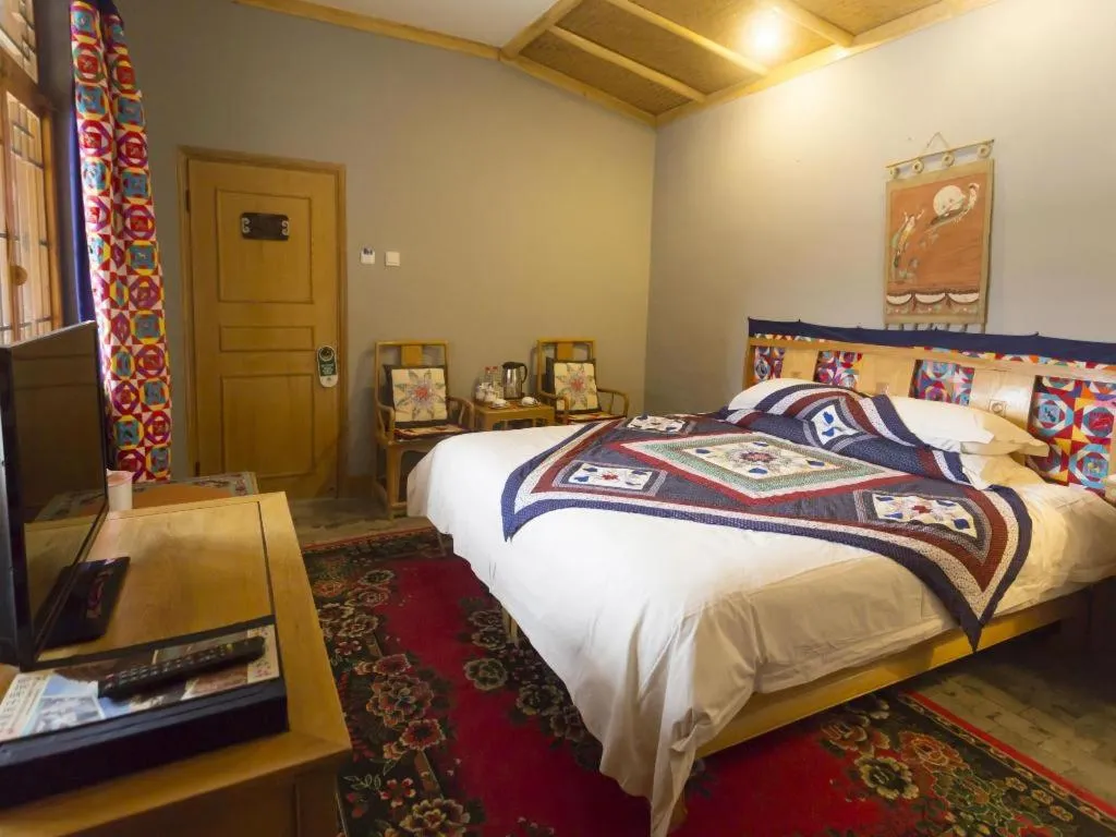 Bed in The Silk Road Dunhuang Hotel