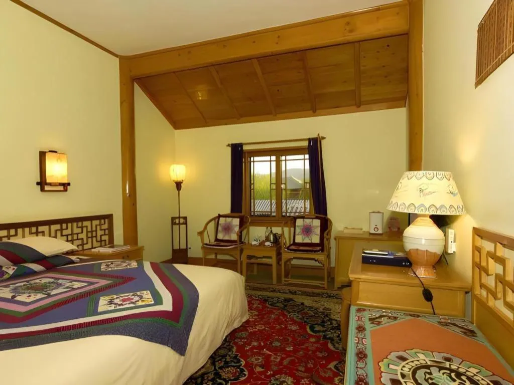 Bed in The Silk Road Dunhuang Hotel