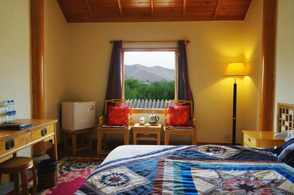 Bed in The Silk Road Dunhuang Hotel